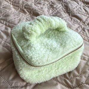 Pale pastel green fuzzy mini jewelry travel bag